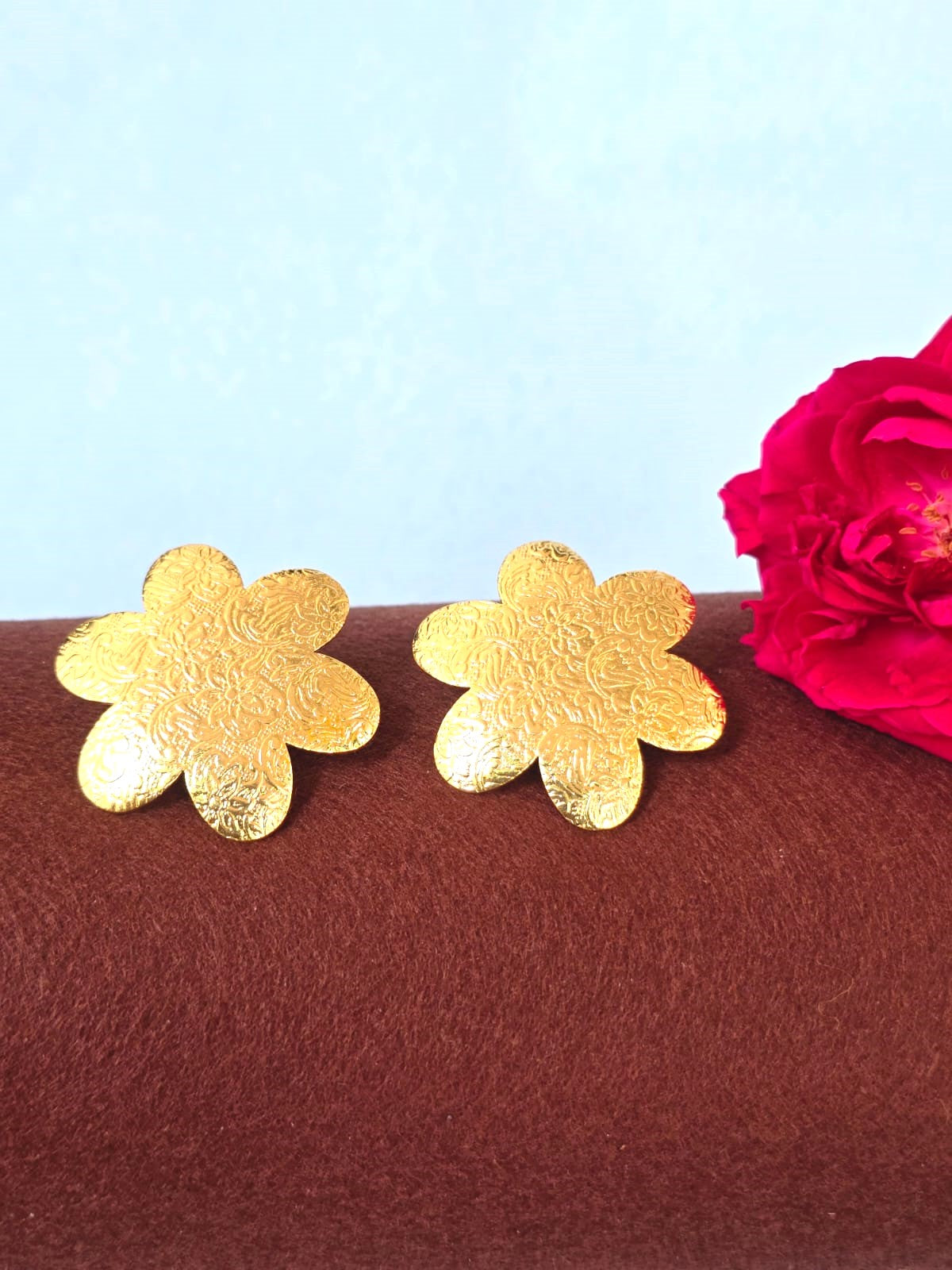 gold-finish floral brass stud earrings