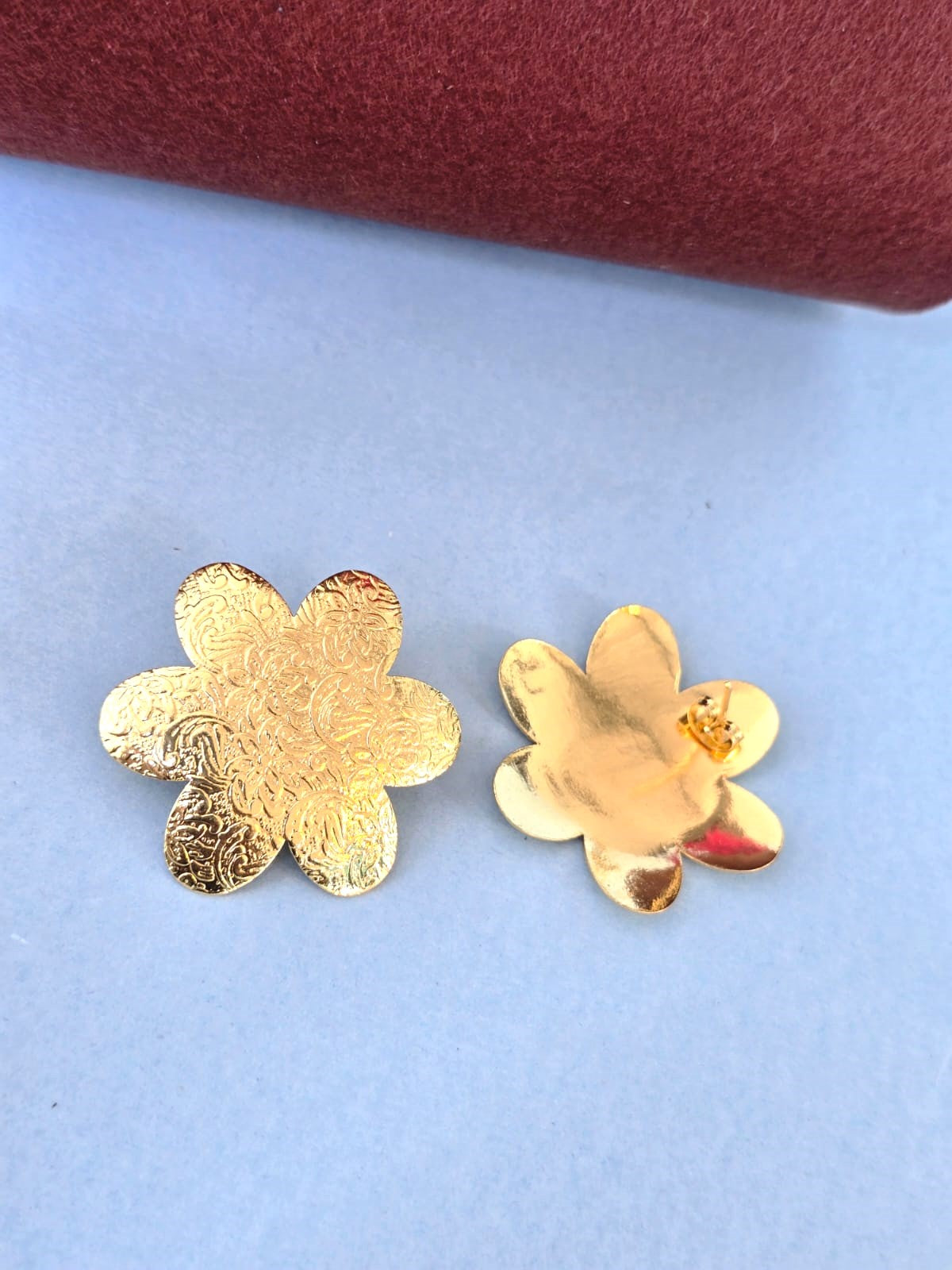 gold-finish floral brass stud earrings