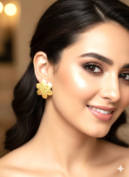 gold-finish floral brass stud earrings